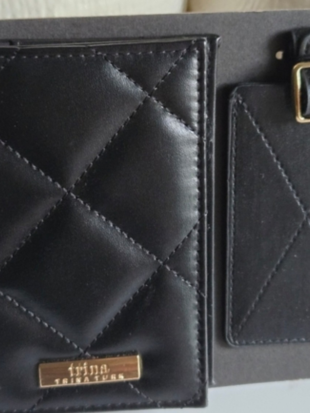 Trina Turk Black Quilted Passport Wallet with Gold Logo Plate